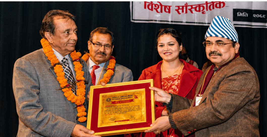 Sudhir Raj Adhikari receiving national recognition at award ceremony