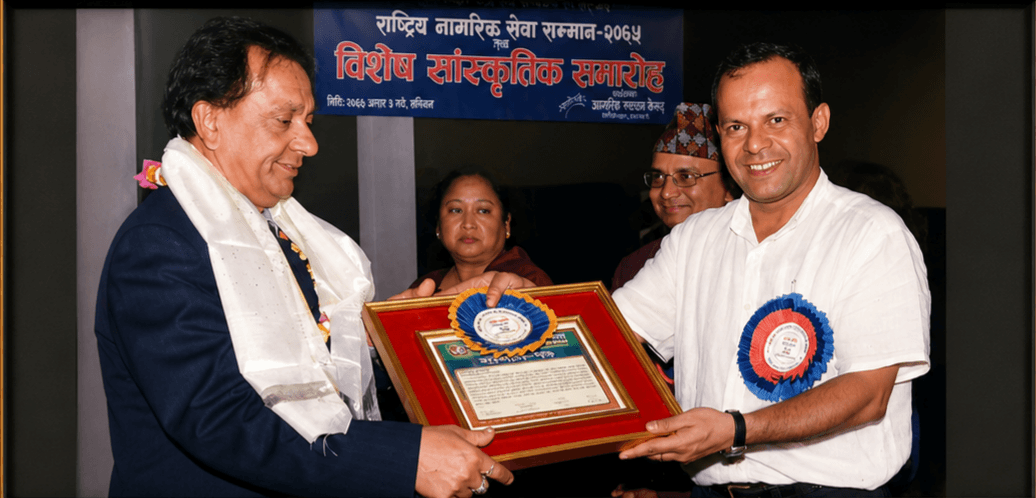 Sudhir Raj Adhikari receiving Shiksha Sewa Samman 2073 BS